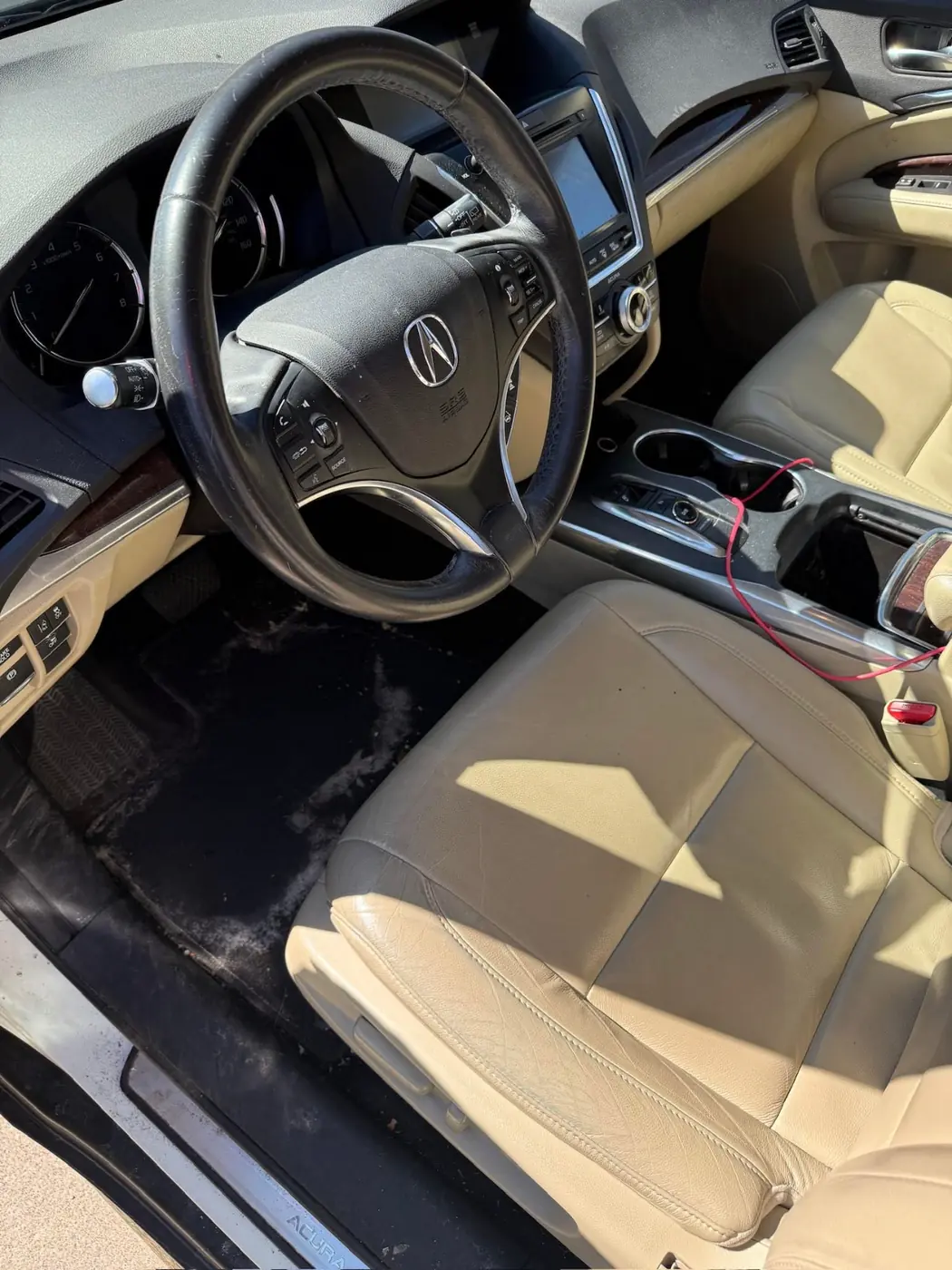 Acura front cabin with tan leather, before