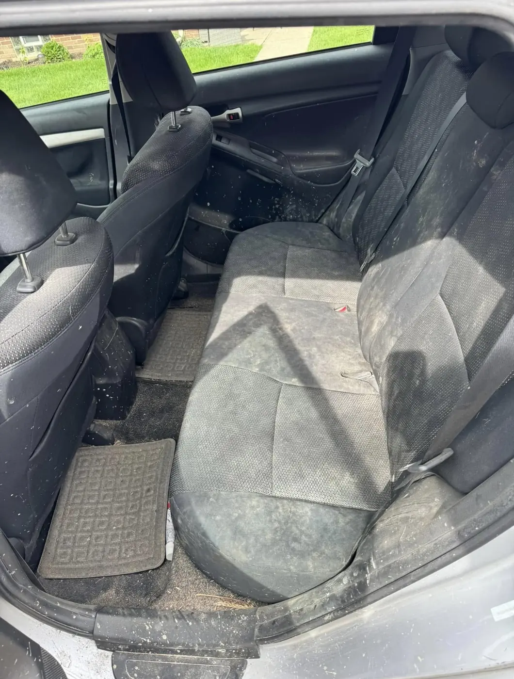 Rear cloth bench seat and floor, before