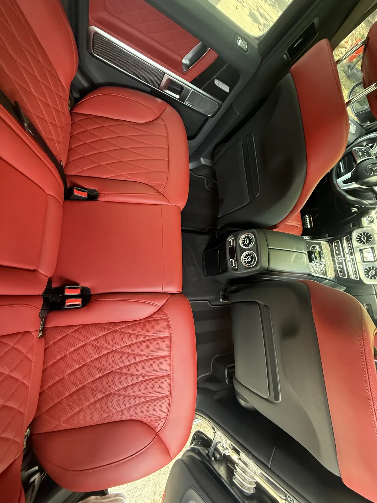 Red quilted leather rear seats inside a Mercedes G-Class