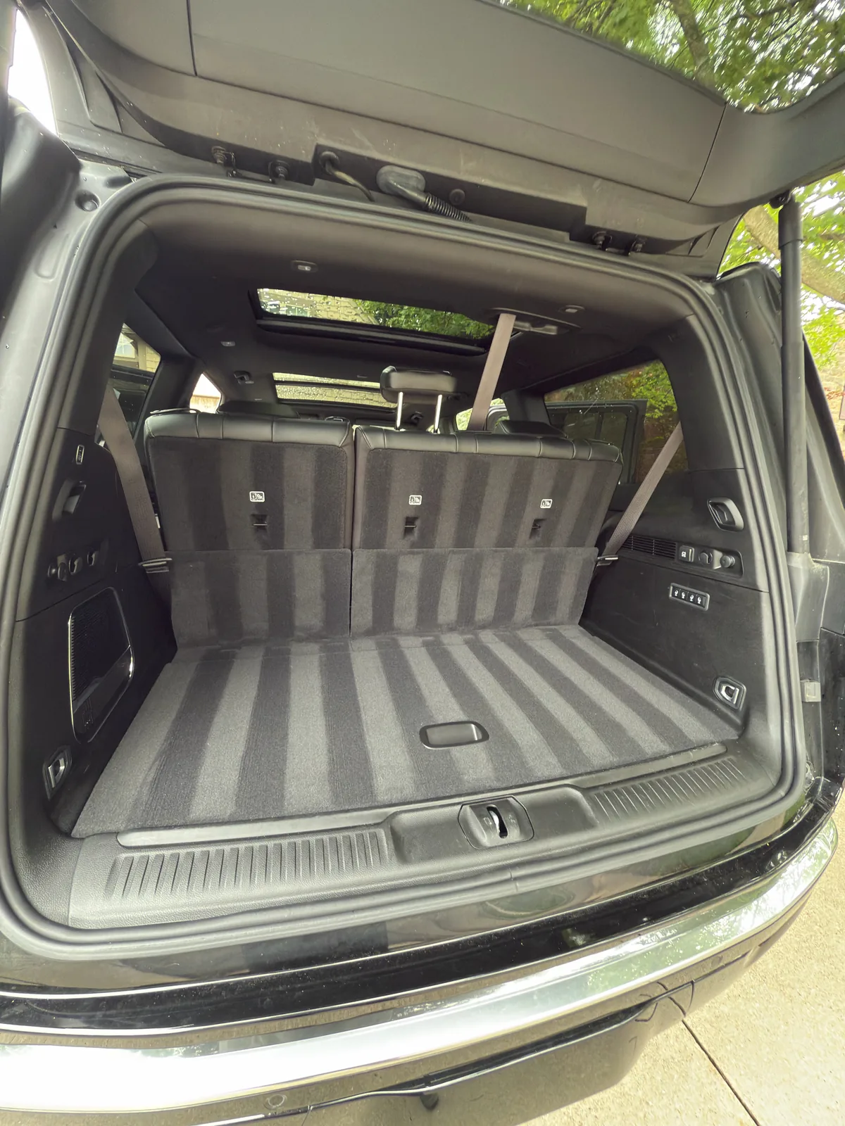 SUV cargo area with the seats folded, looking in from the tailgate